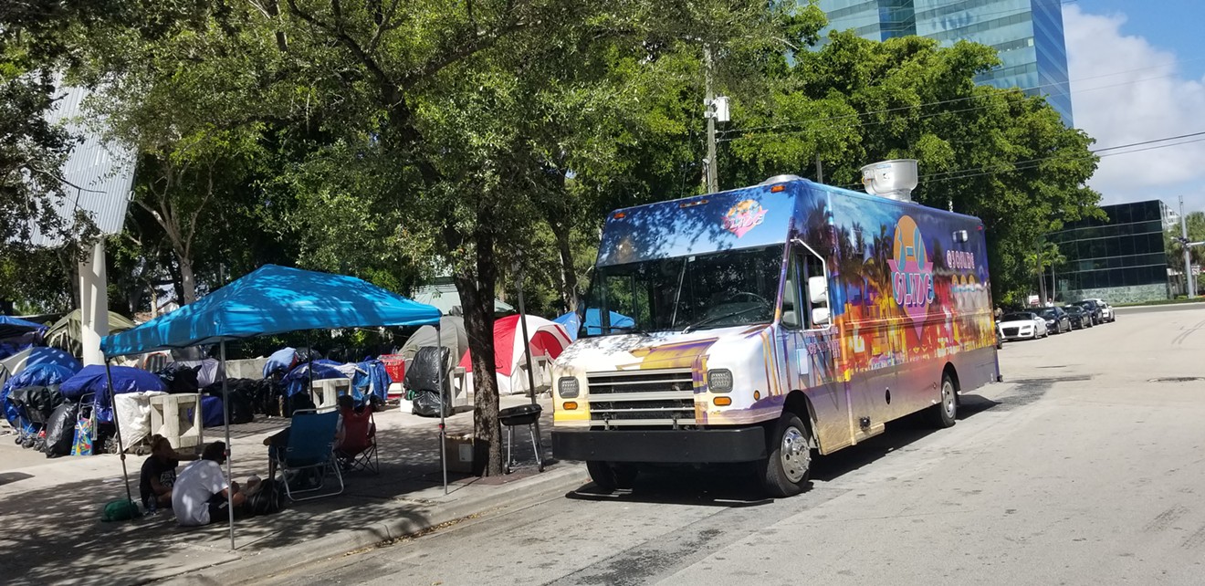 The 3-0 Slide truck recently parked at the homeless camp near Fort Lauderdale's Main Library to feed more than 85 folks.