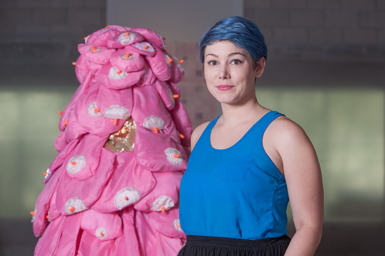 Jenn Clay next to one of her perfomative sculptures.
