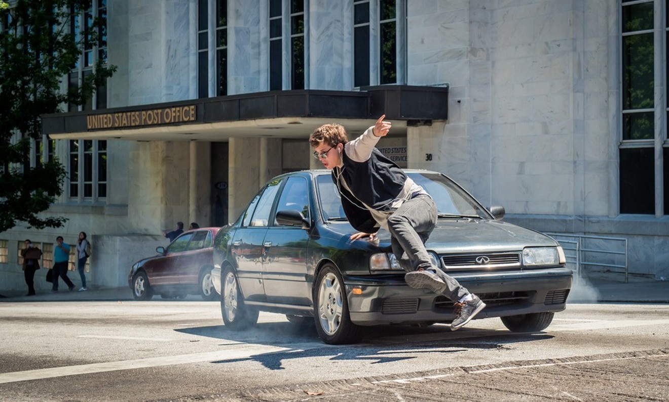 Ansel Elgort, dancing with a car.