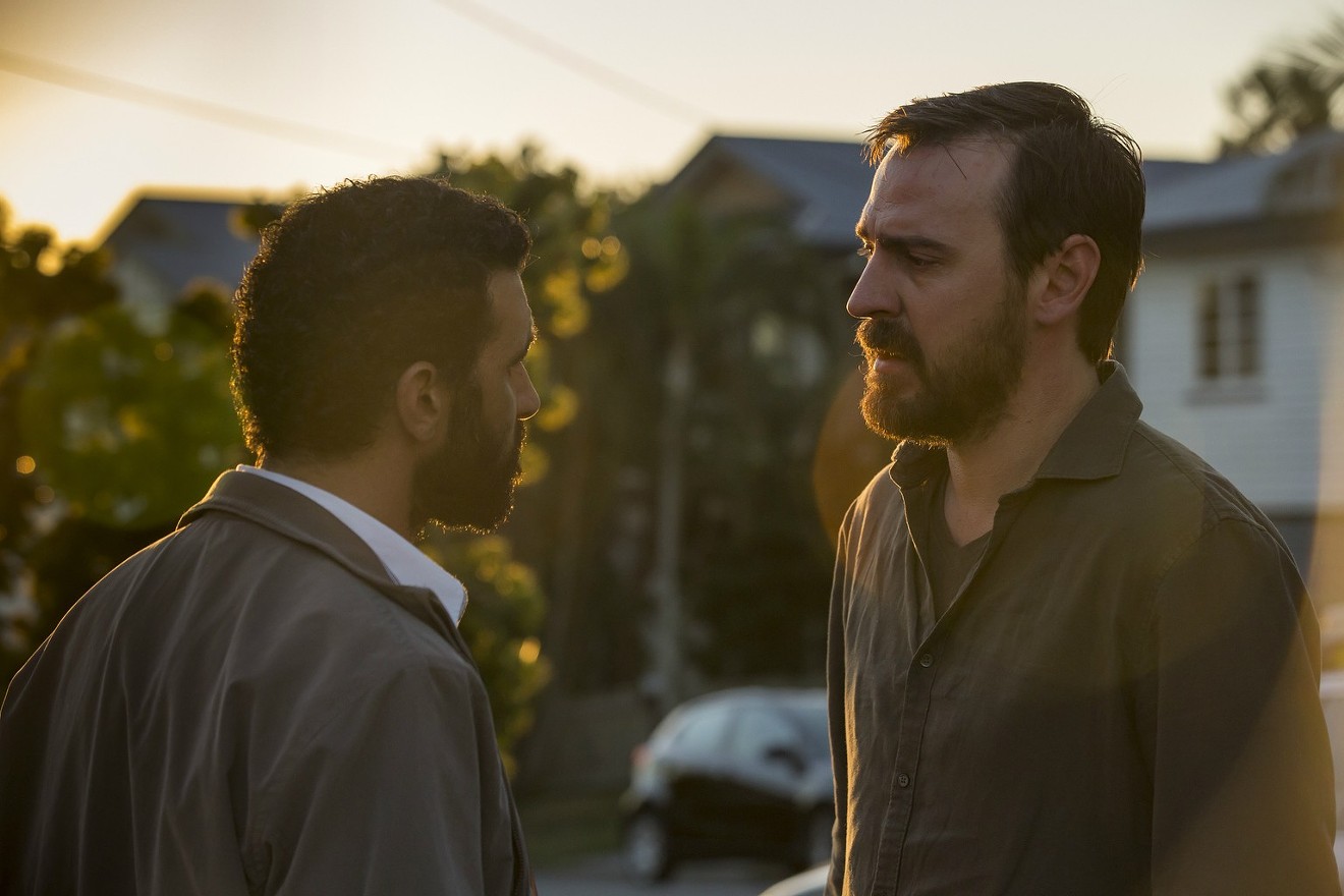 Hazem Shammas (left) plays Ismail, a survivor among 40 refugees found dead in the water, and Ewen Leslie is Ryan,  the sailboat’s captain he sees five years later on the streets of Brisbane, in Safe Harbour, a melodrama airing on Hulu.