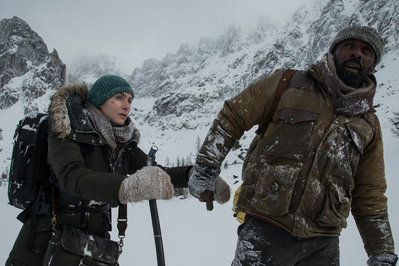 Idris Elba (right) and Kate Winslet are strangers who are brought together after the small plane they charter crashes in the high country in The Mountain Between Us.