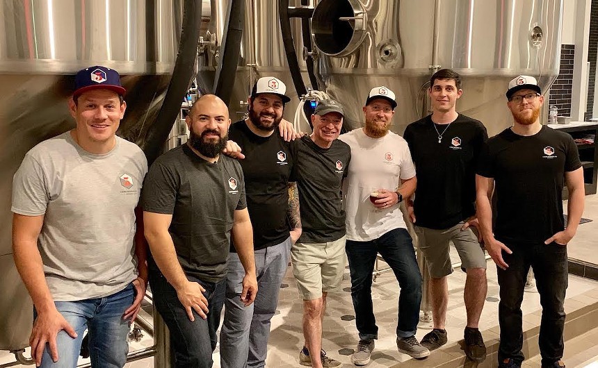 The 3 Sons Brewing team including owner-brewer Corey Artanis (third from right). - 3 SONS BREWING CO.