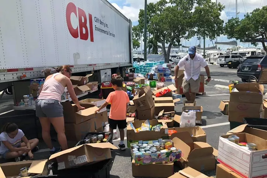 Volunteers for Hope 4 Hope Town organize the results of Wednesday's outpouring of donations. - PHOTO COURTESY OF HOPE 4 HOPE TOWN