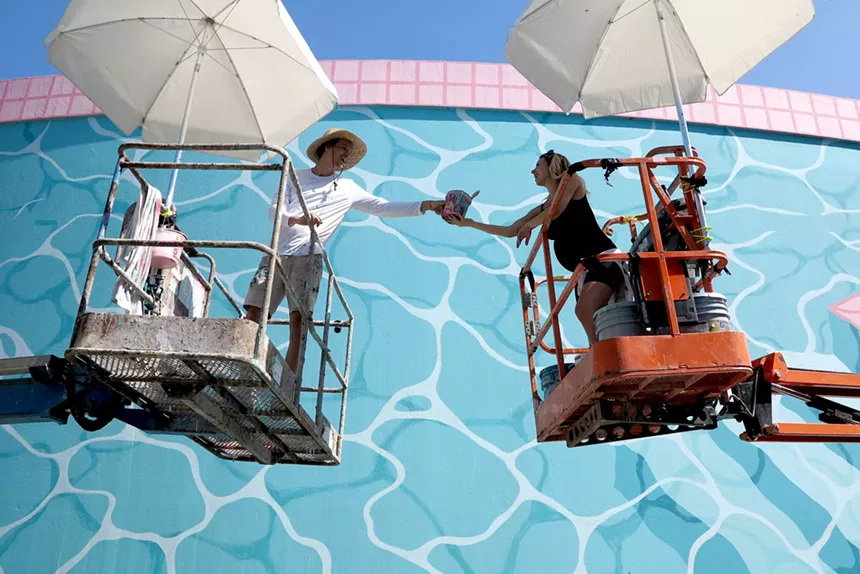 Jeffrey Noble and Alison Matherly of Nice'n Easy work on the North Beach water tank project. - PHOTO COURTESY OF NICE'N EASY