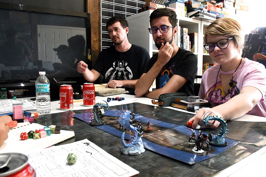Walter Irvine (left), Peter Kamenkovich, and Natalie Foertter were among the D&D players at a recent Loot Comics get-together before it shuttered. - PHOTO BY DAN EVANS