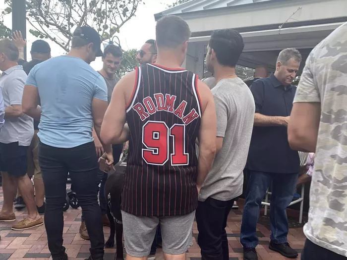 Rodman fans scurry out of his way, opening up a path like in one of those viral videos of a shark swimming through a school of fish. - PHOTO BY JESS SWANSON