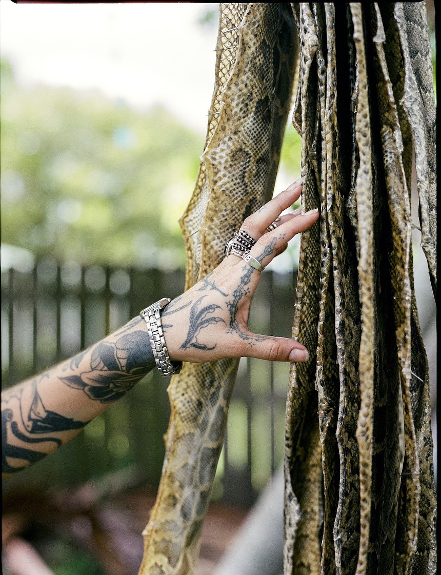 Python skins hang to dry. - PHOTO BY YSA PÉREZ