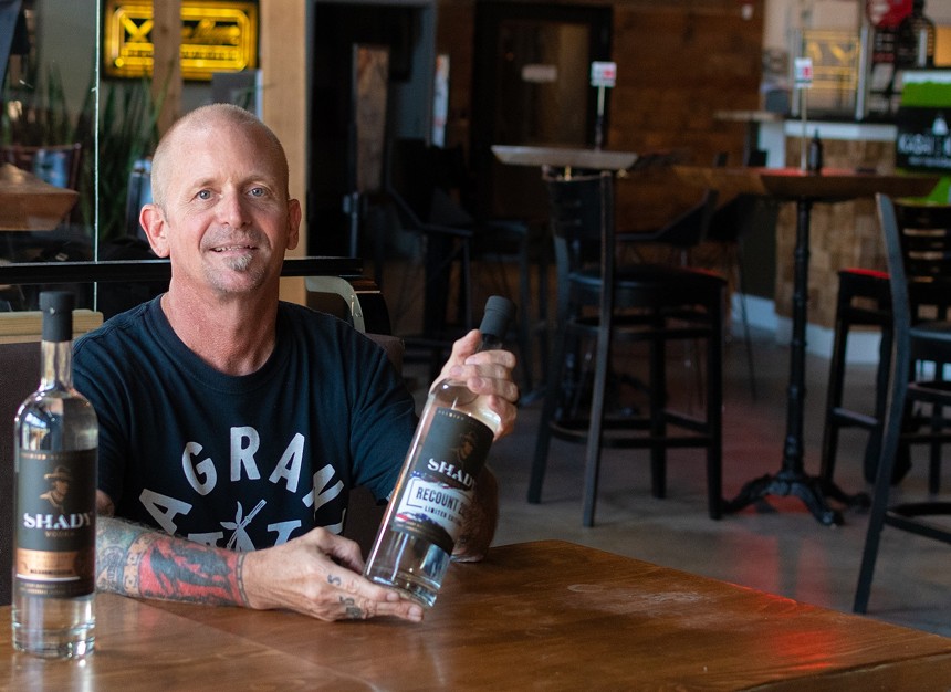 Shady Distillery head distiller Jonny VanPlanck at the Fort Lauderdale Sistrunk Marketplace and Brewery. - PHOTO BY CAILIN BYRNE